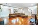 Open living room with hardwood floors and a view of the kitchen at 417 Stowe Rd, Belmont, NC 28012