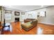 Living room with hardwood floors and a comfortable leather sectional sofa at 417 Stowe Rd, Belmont, NC 28012
