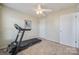 Bright bedroom with carpet flooring, ceiling fan, and ample closet space at 4911 Stowe Derby Dr, Charlotte, NC 28278