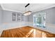 Bright dining room with hardwood floors, chandelier, and large windows at 5300 Haynes Hall Pl, Charlotte, NC 28270