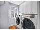 Convenient laundry room with washer, dryer, and cabinets at 5300 Haynes Hall Pl, Charlotte, NC 28270