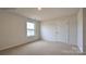 Cozy bedroom with a window, carpet, and neutral tones at 879 Two Brothers Ln, York, SC 29745