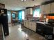 Open kitchen with ample counter space and a dining area at 1355 Oak Breeze Dr, Mooresville, NC 28115