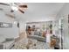 Open living space with a grey sofa, coffee table, and views into the kitchen at 14917 Boudins Ln, Charlotte, NC 28278