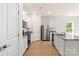 Modern kitchen with white cabinets, granite countertops, and stainless steel appliances at 1524 Doran Ter, Richburg, SC 29729