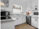 Bright kitchen features white cabinetry, modern appliances, and a sunny window at 2319 Tin Mine Rd, Lincolnton, NC 28092