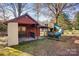 Backyard with storage shed and playset at 236 Sidesmur Ne Ct, Concord, NC 28025