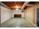 Unfinished basement with built-in shelving and wood paneling at 236 Sidesmur Ne Ct, Concord, NC 28025