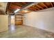 Unfinished basement area with concrete flooring and exposed beams at 236 Sidesmur Ne Ct, Concord, NC 28025