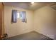 Unfinished basement room with a single window and concrete floor at 236 Sidesmur Ne Ct, Concord, NC 28025