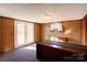 Finished basement room with wood paneling and French doors at 236 Sidesmur Ne Ct, Concord, NC 28025