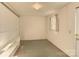 Unfinished basement room with a small window and shelving at 236 Sidesmur Ne Ct, Concord, NC 28025