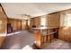 Basement recreation area with wood paneling and bar at 236 Sidesmur Ne Ct, Concord, NC 28025