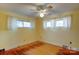 Bedroom with hardwood floors, neutral walls, and ceiling fan at 236 Sidesmur Ne Ct, Concord, NC 28025