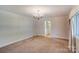 Bright dining room featuring a chandelier and carpet flooring at 236 Sidesmur Ne Ct, Concord, NC 28025