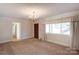 Dining room with carpet, chandelier and view to entryway at 236 Sidesmur Ne Ct, Concord, NC 28025