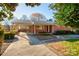 Front view of brick ranch home with driveway at 236 Sidesmur Ne Ct, Concord, NC 28025
