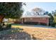 Brick ranch home with carport and mature landscaping at 236 Sidesmur Ne Ct, Concord, NC 28025