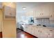 Kitchen with white cabinets, stainless steel appliances and wood flooring at 236 Sidesmur Ne Ct, Concord, NC 28025