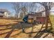 Wooden playset with slide and swings in backyard at 236 Sidesmur Ne Ct, Concord, NC 28025