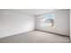 Empty bedroom featuring neutral carpet and a window overlooking the fenced backyard at 2632 Goose Fair Rd # 62, Maiden, NC 28650