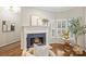 Fireplace with blue tile surround and white mantel at 314 W 10Th St, Charlotte, NC 28202