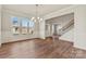 Bright dining room with hardwood floors and wainscoting at 316 Coronado Ave, Matthews, NC 28104