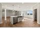 Open kitchen with large island, stainless steel appliances, and breakfast area at 316 Coronado Ave, Matthews, NC 28104