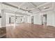 Bright living room with coffered ceilings, hardwood floors, and open floor plan at 316 Coronado Ave, Matthews, NC 28104