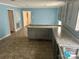 Bright blue kitchen with ample counter space, and grey cabinets at 321 Corriher Heights Ave, China Grove, NC 28023