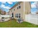 Tan house exterior with deck, fenced yard, and AC unit at 3307 Tempo Ln, Indian Land, SC 29707