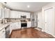 Modern kitchen with white cabinets and stainless steel appliances at 3307 Tempo Ln, Indian Land, SC 29707