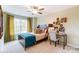 Charming bedroom with a comfy bed, built-in workspace, and natural light at 4107 Black Ct # 166, Harrisburg, NC 28075