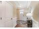 Bright and airy foyer with wainscoting and a stylish rug at 4107 Black Ct # 166, Harrisburg, NC 28075