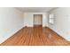 Bright living room featuring hardwood floors and large windows at 4720 Aspen Ct, Charlotte, NC 28210