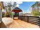 Spacious backyard deck with a wooden gazebo, perfect for outdoor entertaining at 6405 Mill Grove Rd, Indian Trail, NC 28079