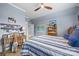 Blue themed bedroom with desk, walk-in closet and ceiling fan at 962 Castlewatch Dr, Fort Mill, SC 29708