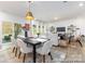 Modern dining room with a black table, gray chairs, and open floor plan at 1108 Alyssa Oaks Dr # 3, Lowell, NC 28098