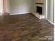 Living room with hardwood floors and a fireplace at 11105 Harrowfield Rd, Charlotte, NC 28226