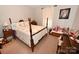 Classic bedroom features a four-poster bed, floral decor, and neutral walls at 1156 13Th Avenue Ne Cir, Hickory, NC 28601