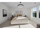 Spacious bedroom featuring a king-size bed and large window with natural light at 13005 Moon Rd # 43, Charlotte, NC 28277