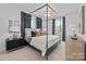 Elegant bedroom with a four-poster bed, and plenty of natural light at 13005 Moon Rd # 43, Charlotte, NC 28277