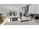 Modern kitchen features a large island, stainless steel appliances, and white cabinets at 13005 Moon Rd # 43, Charlotte, NC 28277