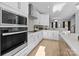 Stainless steel appliances and white shaker cabinets in this modern kitchen at 13005 Moon Rd # 43, Charlotte, NC 28277