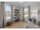 Cozy office or sitting area with a large window, comfortable couch and shelving at 13005 Moon Rd # 43, Charlotte, NC 28277