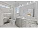 Modern bathroom with double vanity, walk-in shower, and elegant tile at 13009 Moon Rd # 42, Charlotte, NC 28277