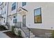 Modern townhome with gray door and white exterior at 13009 Moon Rd # 42, Charlotte, NC 28277