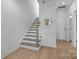 Modern staircase with light wood treads and white risers at 13013 Moon Rd # 41, Charlotte, NC 28277