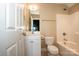 Clean bathroom with a white vanity, toilet and bathtub at 131 Quail Haven Dr, Troutman, NC 28166