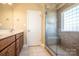 Bathroom with double vanity and walk-in shower at 131 Quail Haven Dr, Troutman, NC 28166